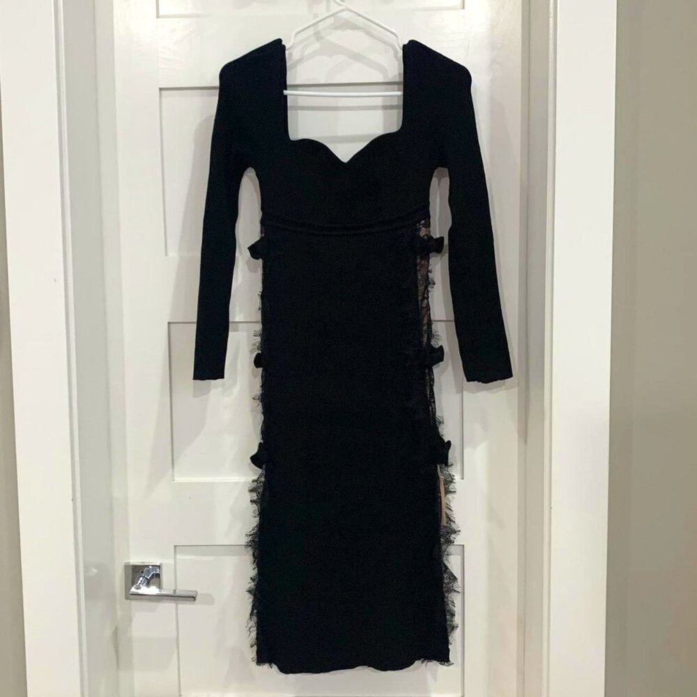 black dress with faux side cut and bows